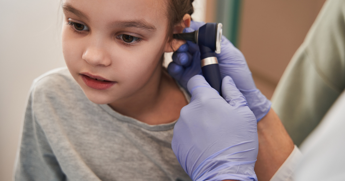 Girl getting her ear checked in preparation for an ENT surgery at Ormiston Hospital