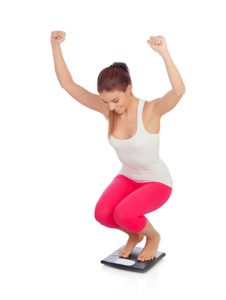 woman-happy-on-scale